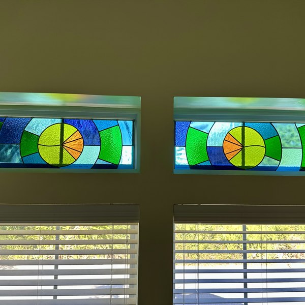 Two stained glass window panels
